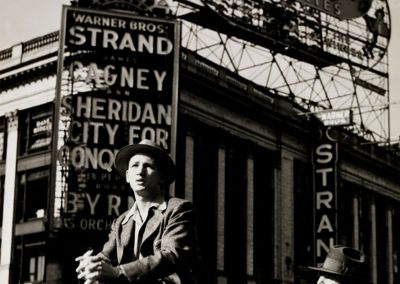 Lou Stoumen, American, 1917-1991. Sitting in Front of the Strand Theater, Times Square, ca. 1940.